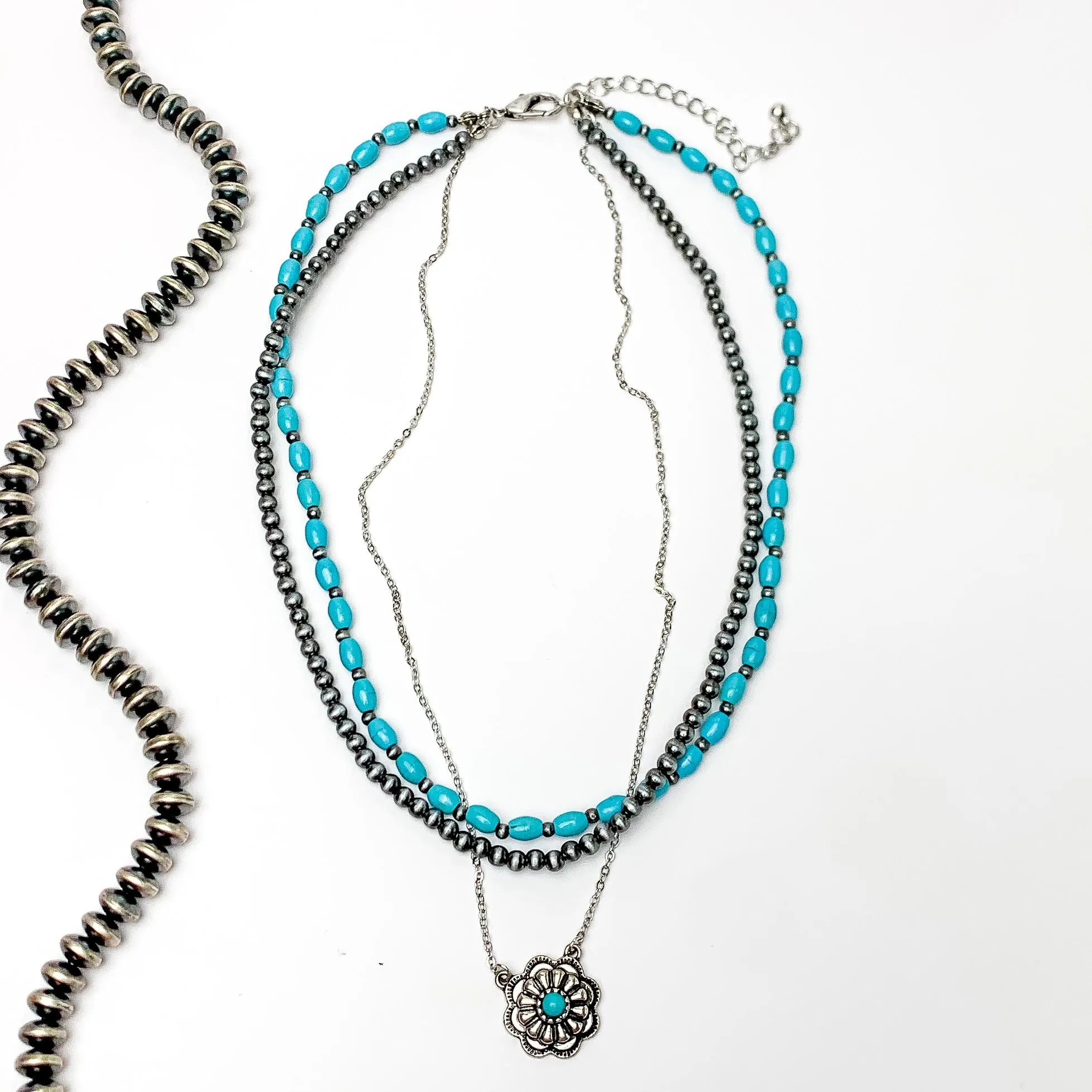 3 Strand Faux Turquoise beads and Navajo Pearls with a Dangling Flower Pendent in Silver Tone