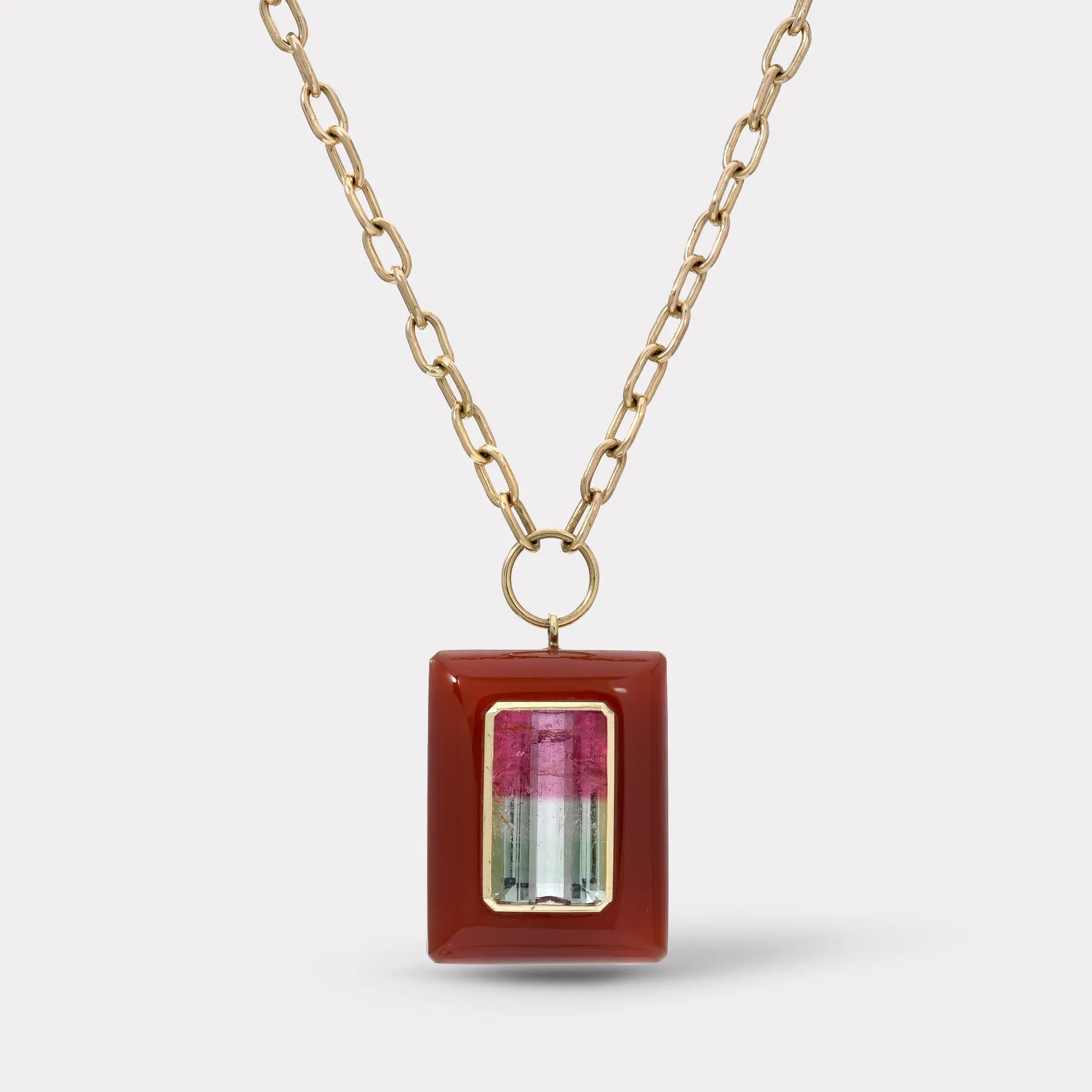 Emerald Cut Bicolor Tourmaline in Hand Carved Carnelian Lollipop Pendant