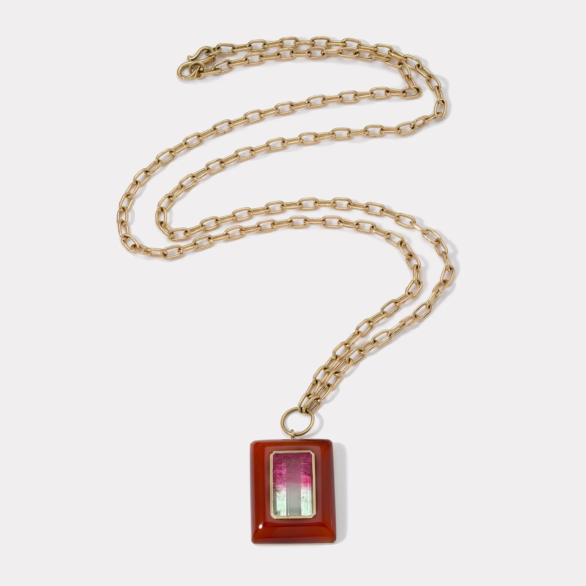 Emerald Cut Bicolor Tourmaline in Hand Carved Carnelian Lollipop Pendant