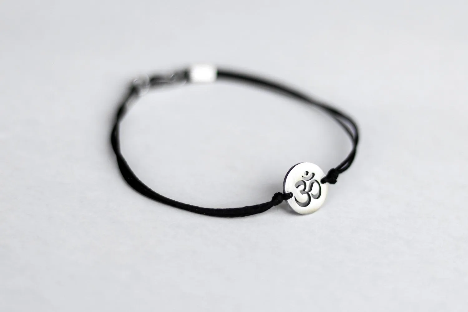 Om bracelet, waterproof bracelet, stainless steel silver Om charm, spiritual yoga jewelry, black cord, gift for her, custom size, mantra