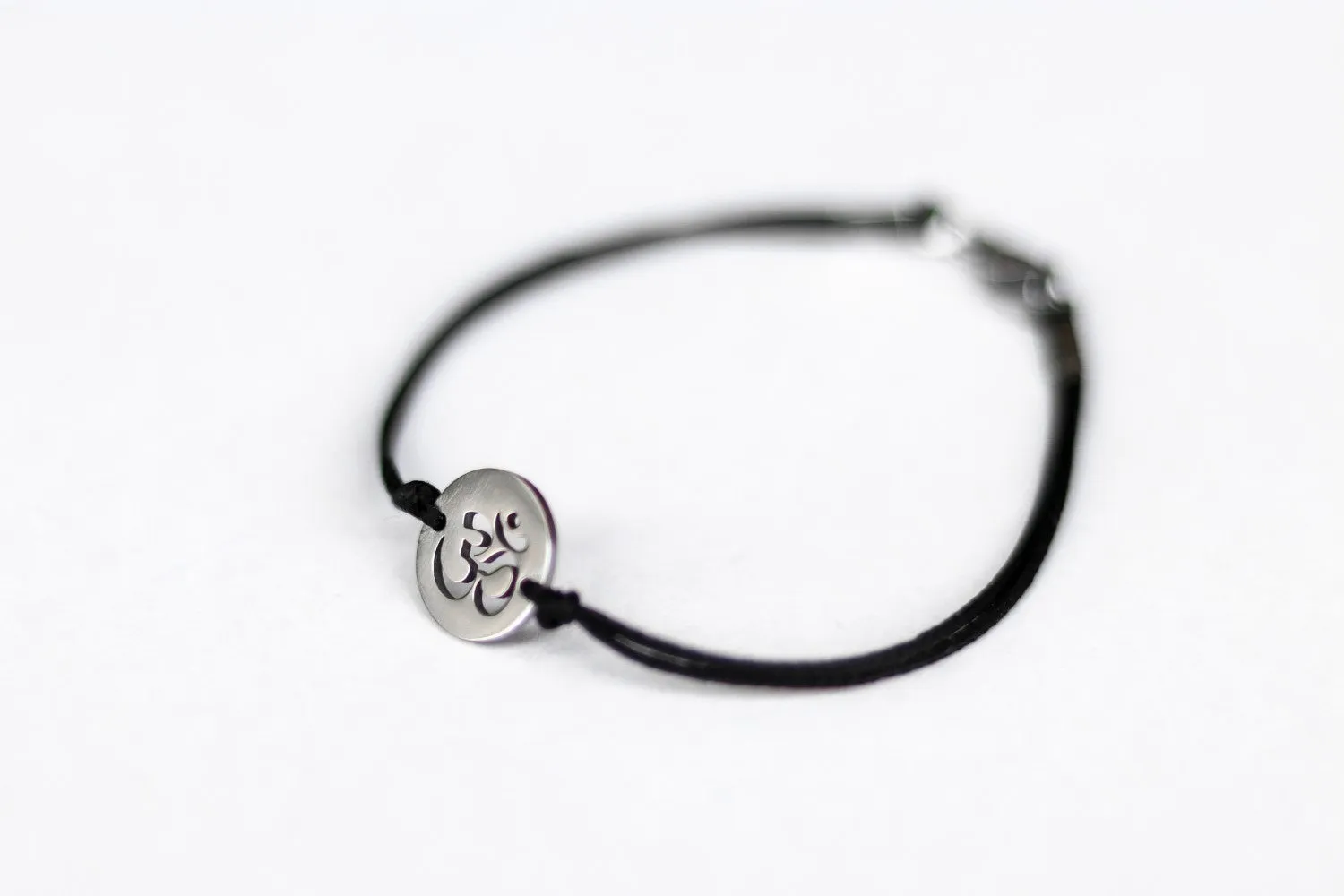 Om bracelet, waterproof bracelet, stainless steel silver Om charm, spiritual yoga jewelry, black cord, gift for her, custom size, mantra