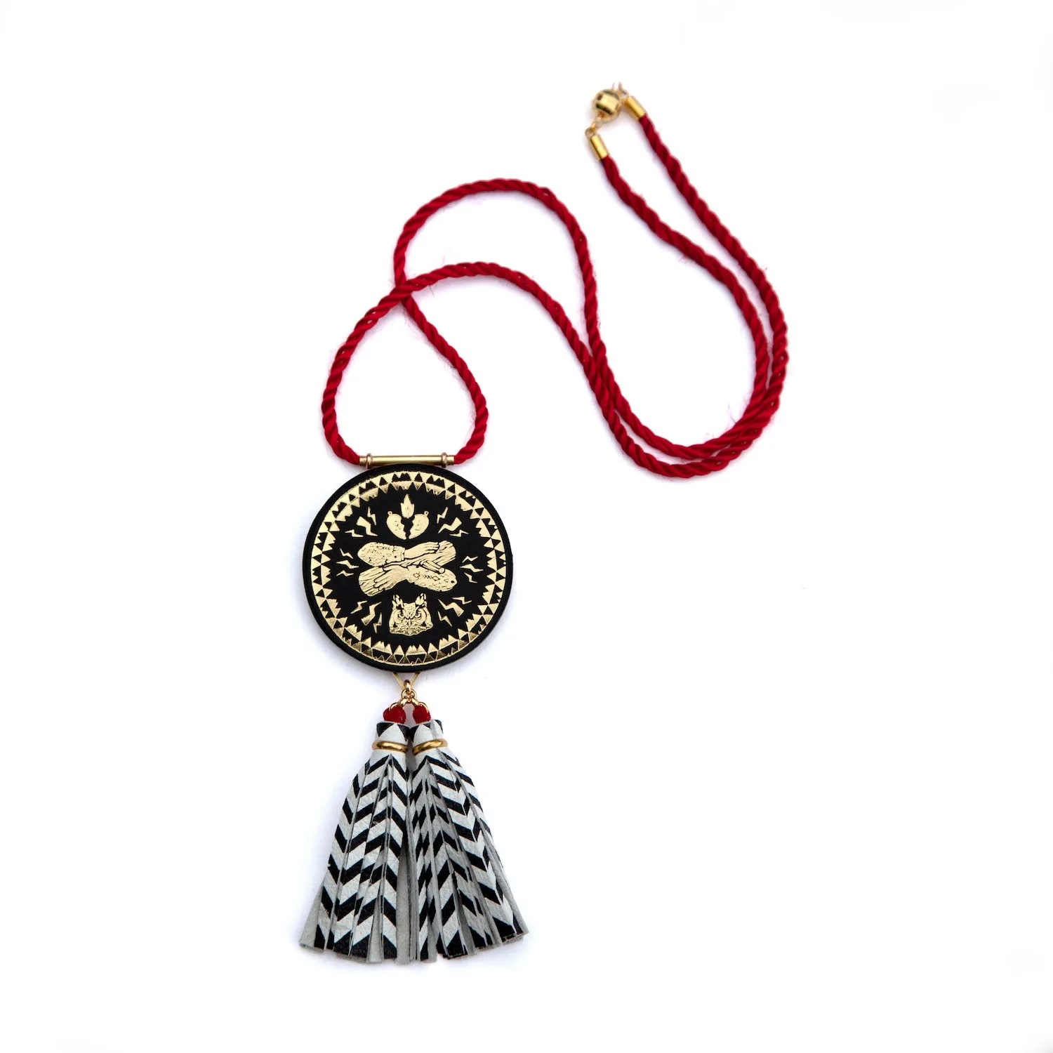 PEAKS & FIRS . tassel medallion